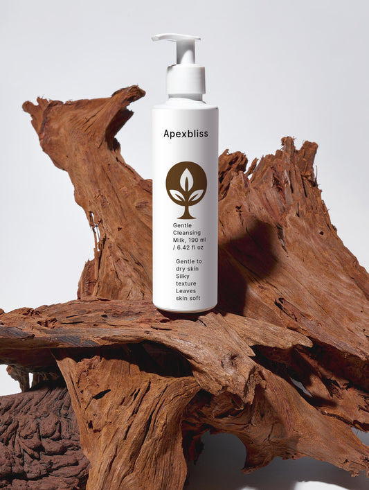 Gentle Cleansing Milk bottle on wooden background, designed for gentle skin cleansing and moisturizing.